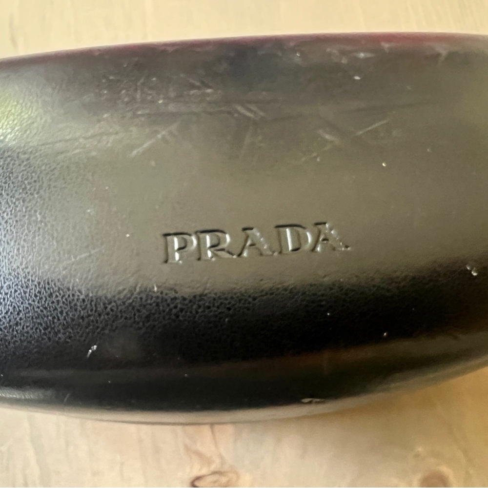 U used Prada sunglasses! Perfect condition, except one lens is peeling.